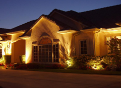 House at Night with Exterior Lights in Port Washington, NY